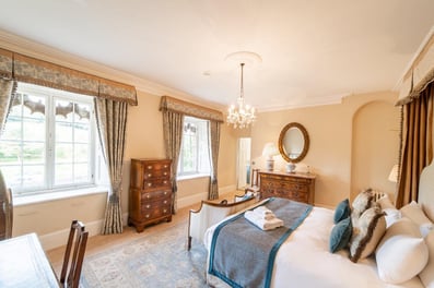 Our calming shades of creams and blue intertwine in this bedroom to create a peaceful stay