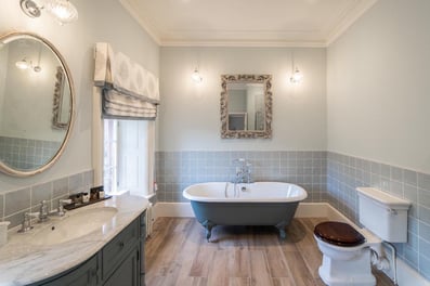A rolltop bath, marble vanity unit and underfloor heating are the features in our bathroom