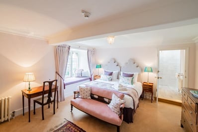 One of our many beautiful bedrooms at Rose Castle - this one with calming shades of pinks and purple